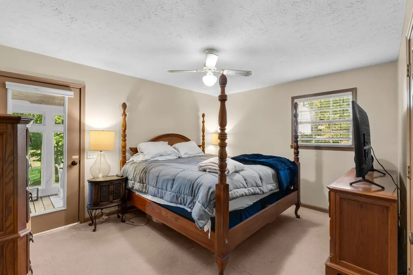 Master bedroom with a four poster bed