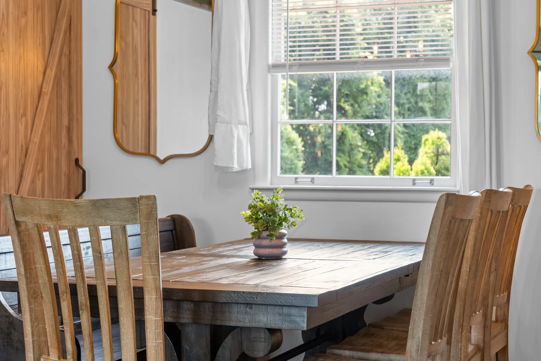 Dining area framed by large windows