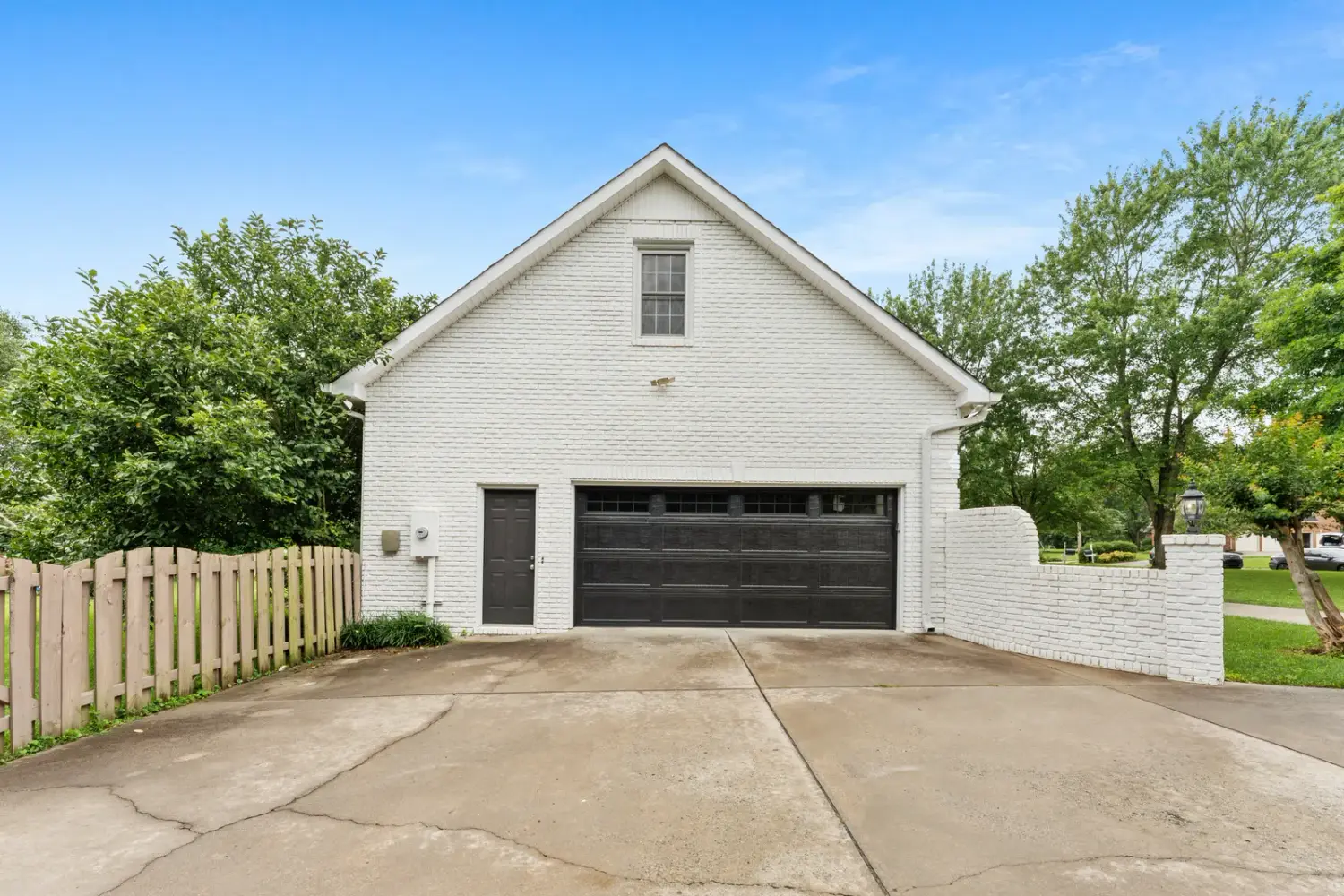 Detached carriage-house garage matching the main home