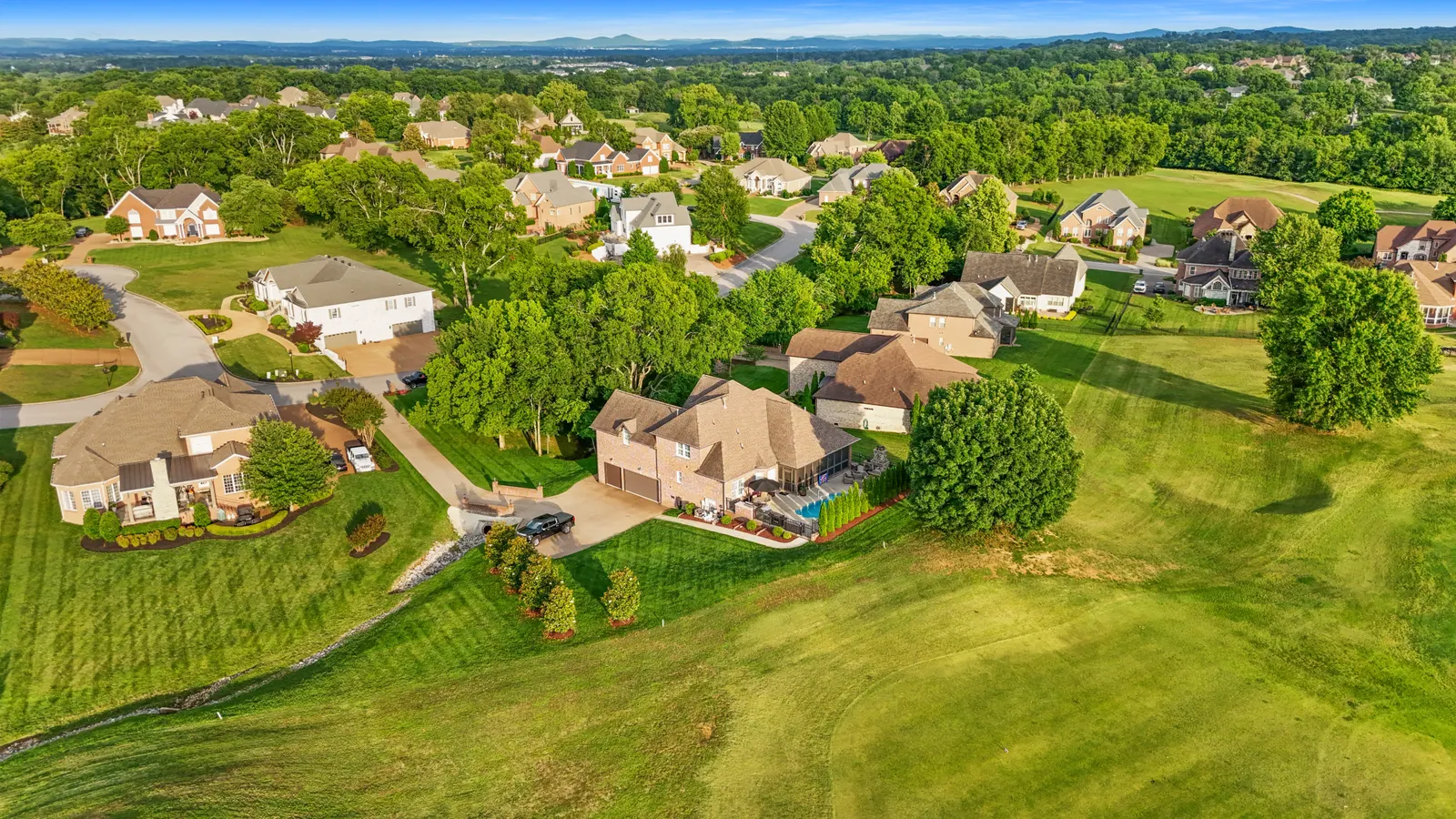 Aerial view of 408 Glenway Cove on a golf-course community in Lebanon