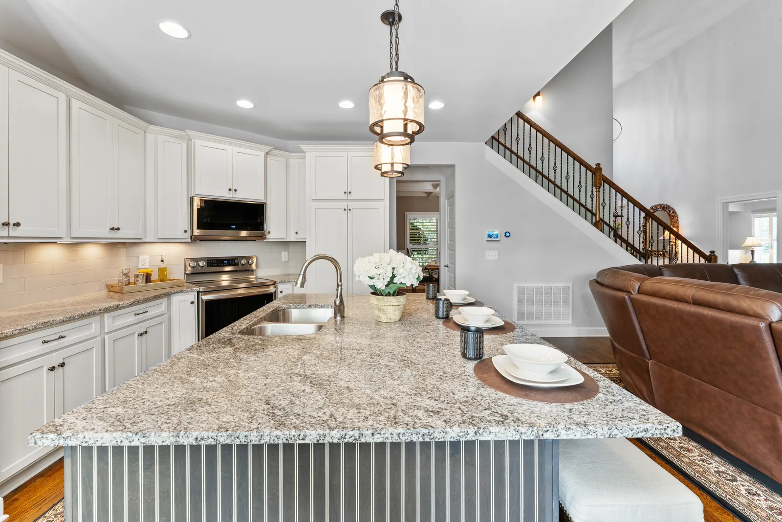 Kitchen with granite island and pendant lighting