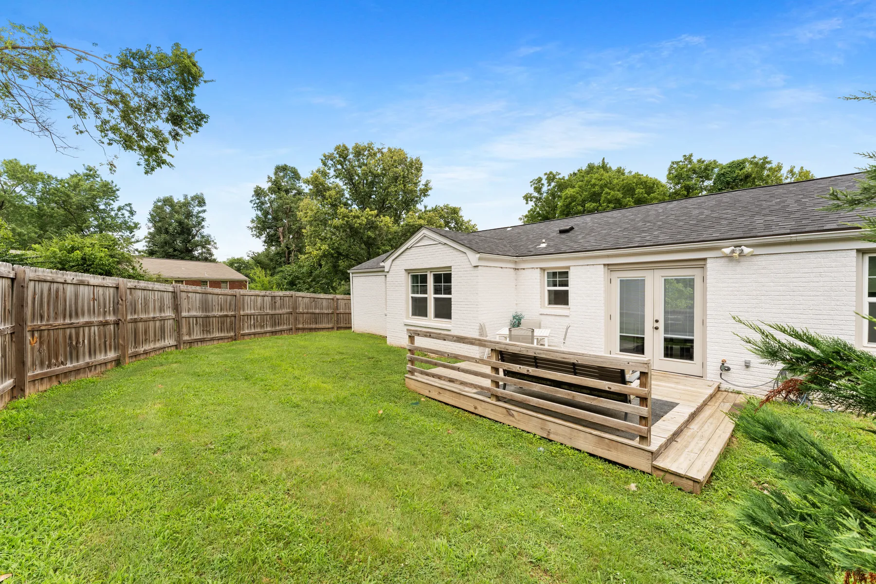Deep, fully fenced backyard