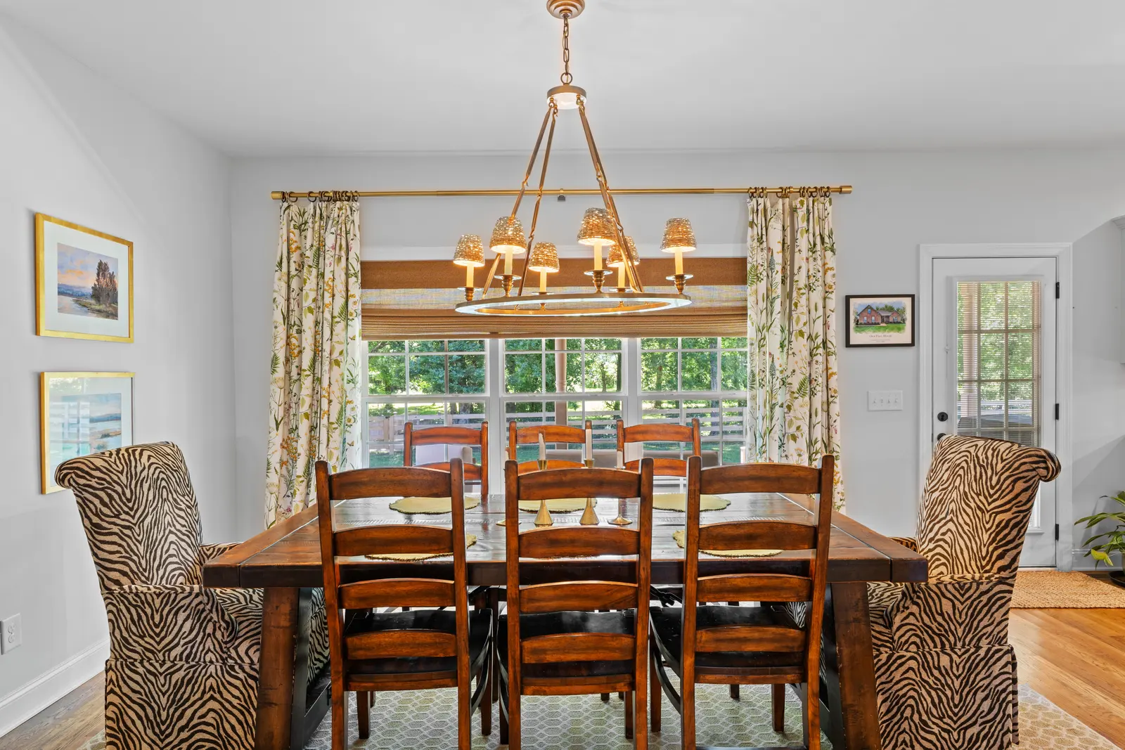 Formal dining room beneath an iron chandelier