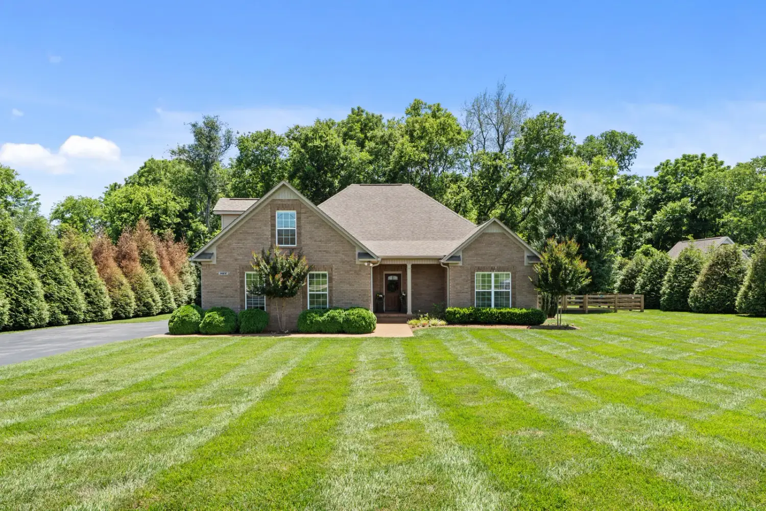 All-brick traditional estate at 1422 Polo Fields Lane, Columbia, on a manicured acre