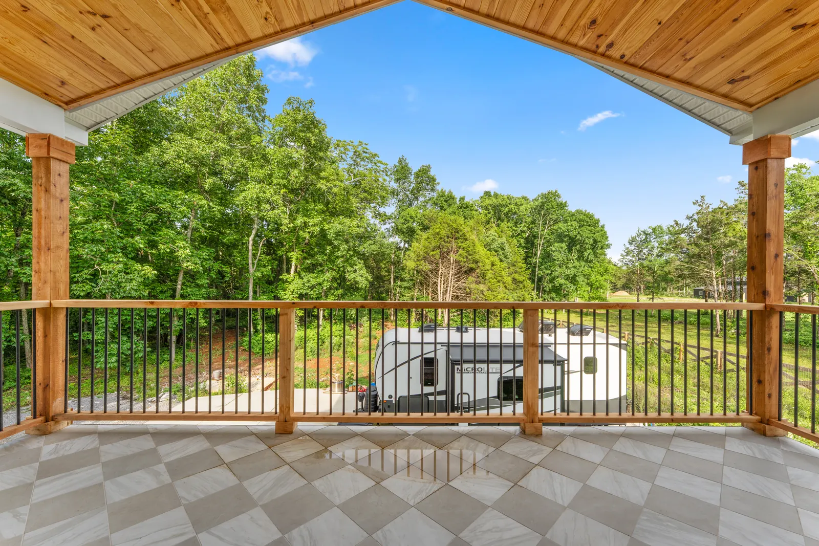 Covered upper balcony overlooking the land