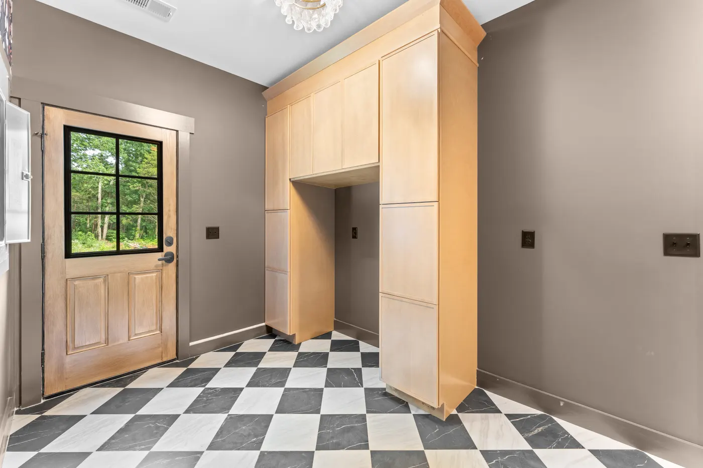 Entry with checkerboard tile floor