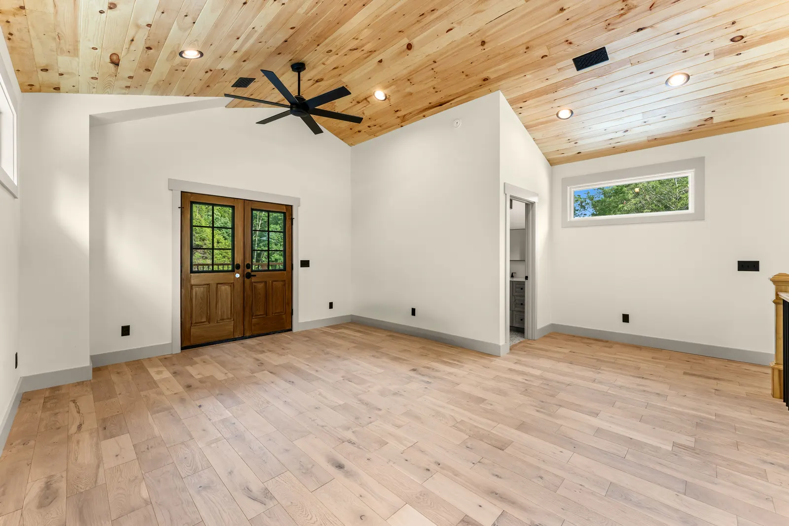 Vaulted great room with wood ceiling